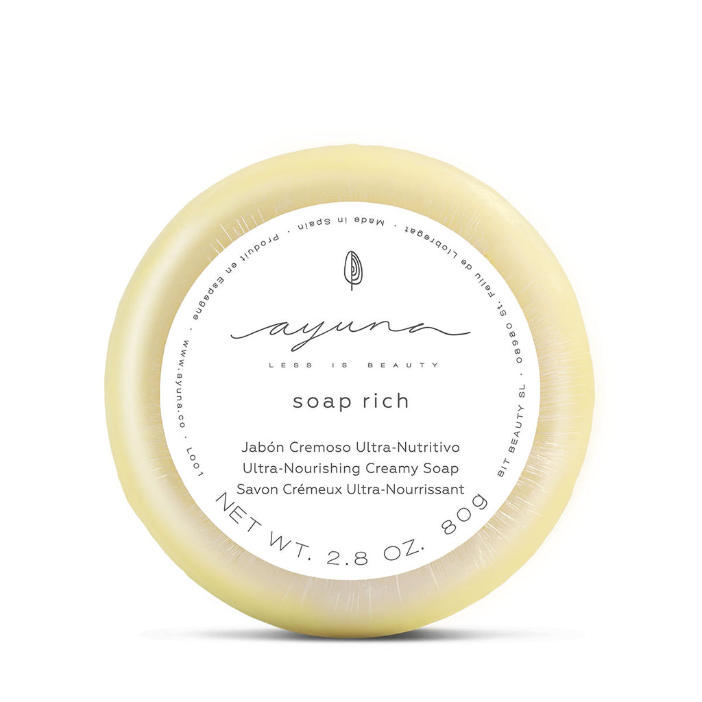 A round bar of ayuna creamy nourishing soap with labeling on a white background.