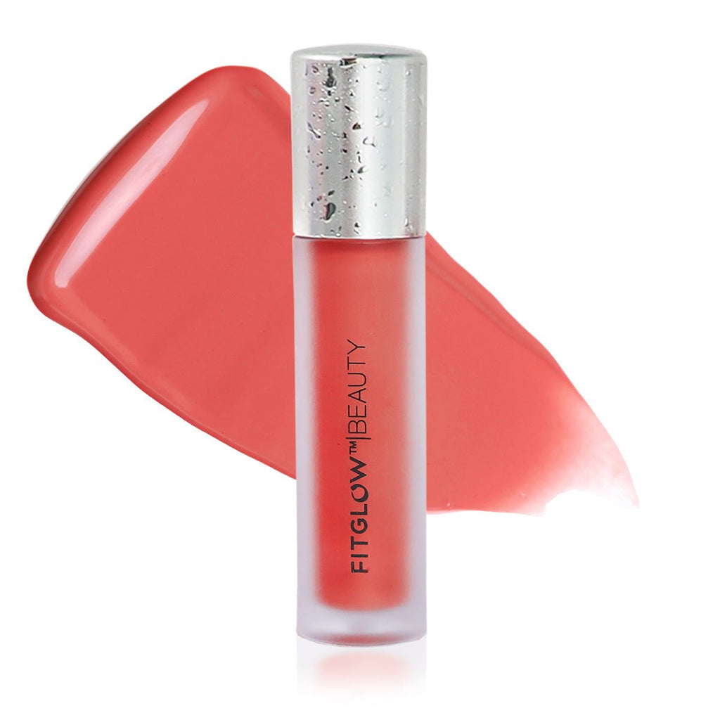 A tube of fitglow beauty lip gloss with its cap tilted to the side, against a white background.