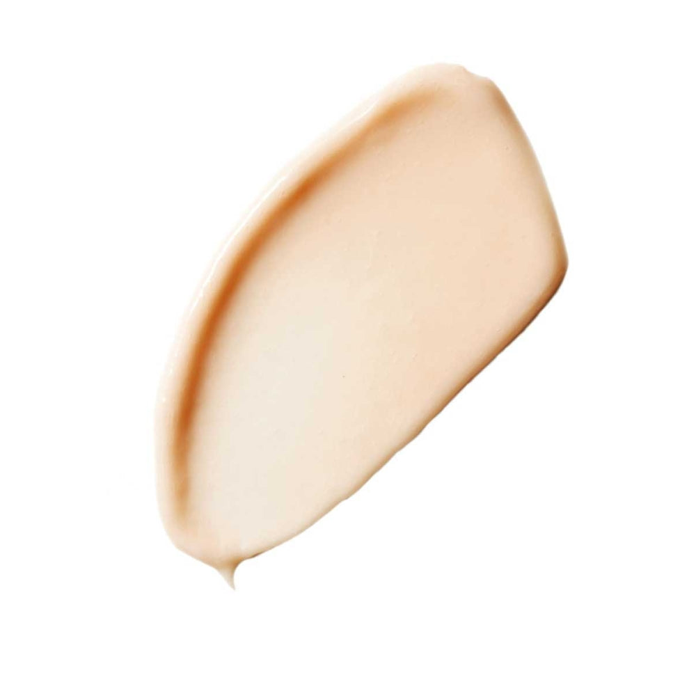 A swatch of liquid foundation makeup on a white background.