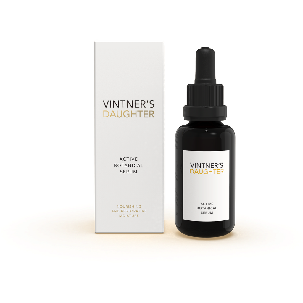 A bottle of vintner's daughter active botanical serum next to its packaging.