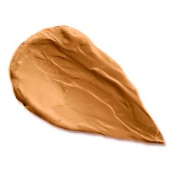A smear of creamy, beige makeup foundation on a white background.
