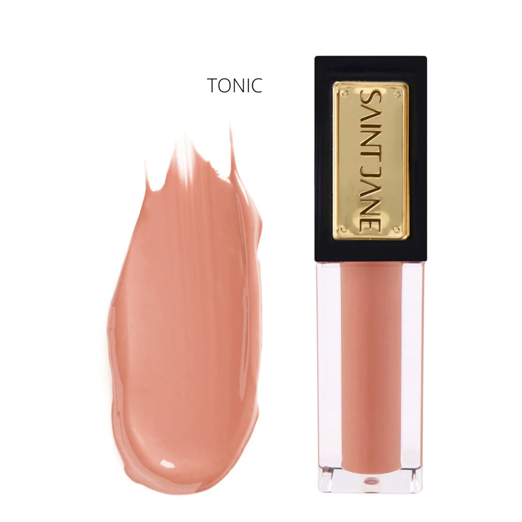 A swatch of pink-toned lip gloss next to its corresponding tube labeled "tonic".