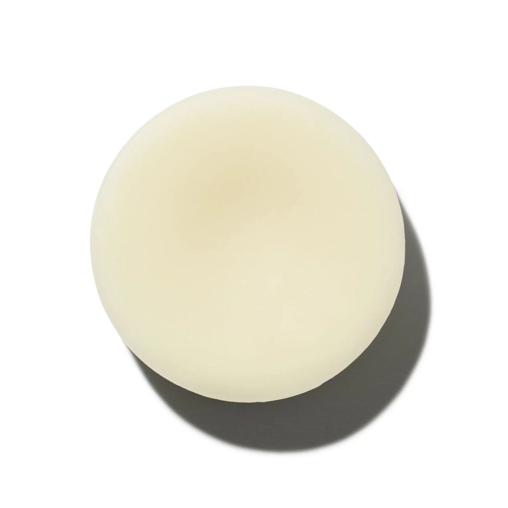 A single egg casting a shadow on a plain white background.