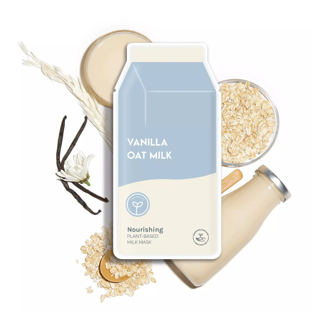 A carton of vanilla oat milk with oats, a bowl of milk, and vanilla pods arranged around it, suggesting a natural, plant-based product.