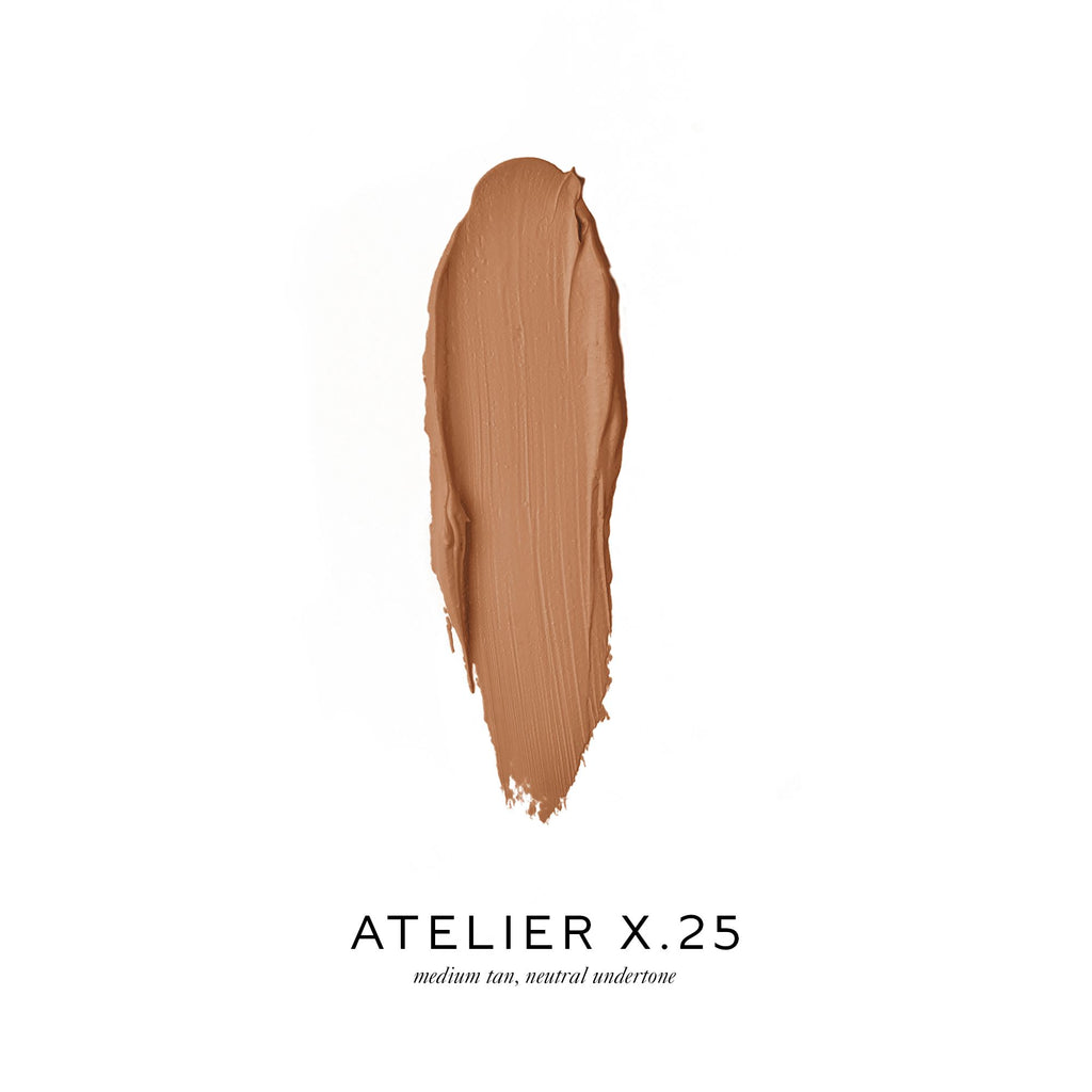 Smear of medium tan foundation with a neutral undertone, labeled "atelier x.25.