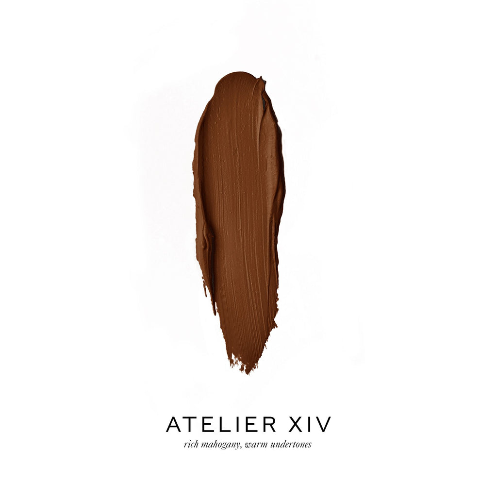 A swatch of rich mahogany brown lipstick with text "atelier xiv" and the description "rich mahogany, warm undertones.